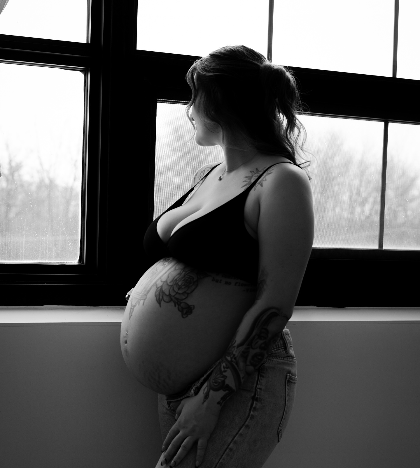 Pregnancy black and grey tattoo on the torso by Megan McKee Tattoo Artist