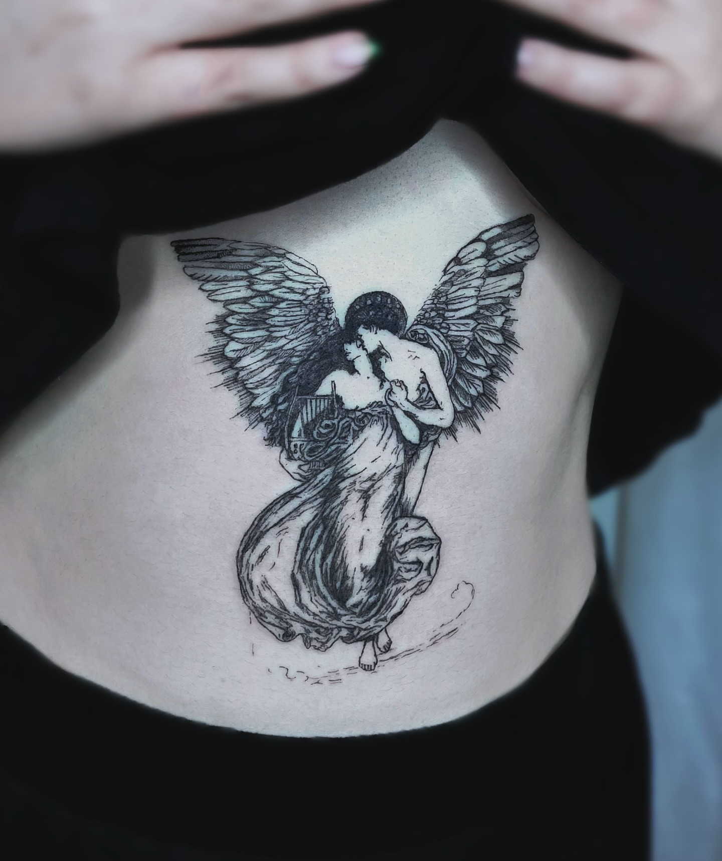 Angel and woman realism tattoo on the torso by Vintage tattoo