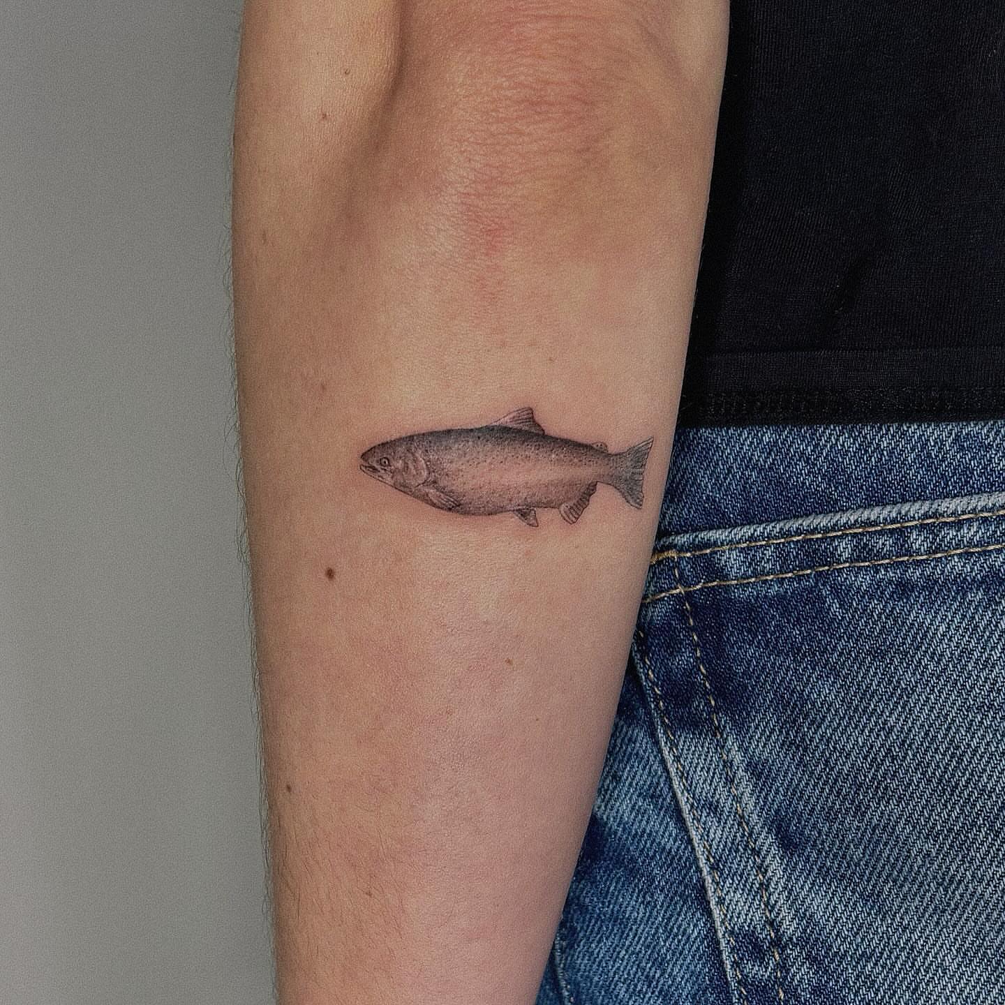 Salmon realism tattoo on the forearm by Alissa Jung