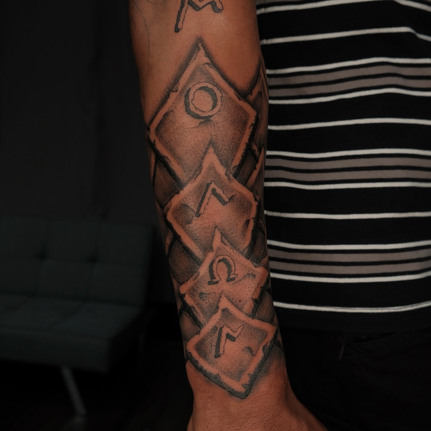 Dice black and grey tattoo on the forearm by Houston Tattoo Artist