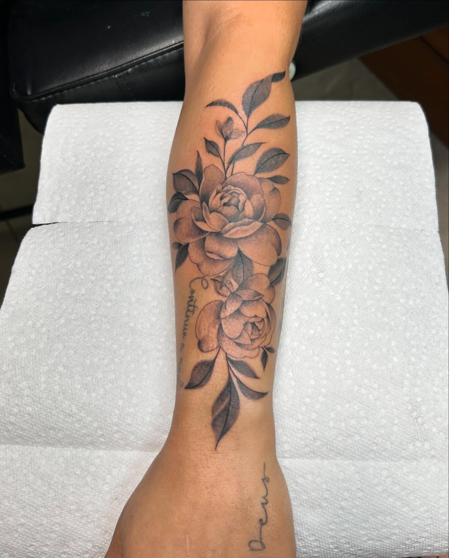 Floral arrangement black and grey tattoo on the forearm by Denis Morello de Castro, South River, New Jersey