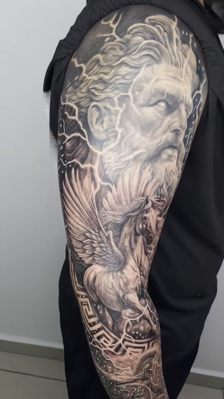Tattoo by @elmertattoo1 — realism, black_and_grey