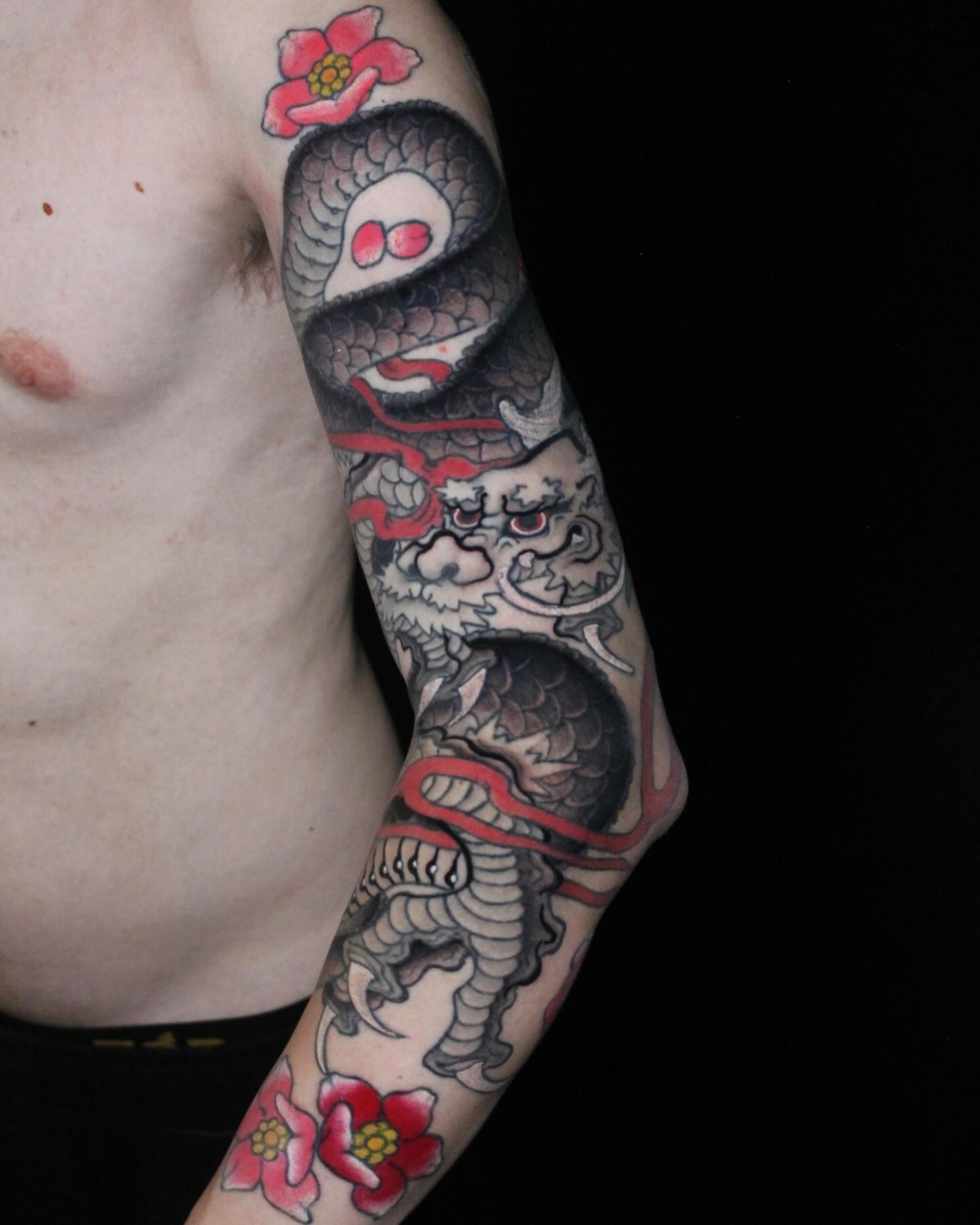 Dragon and flowers japanese irezumi tattoo on the forearm by Alezumie