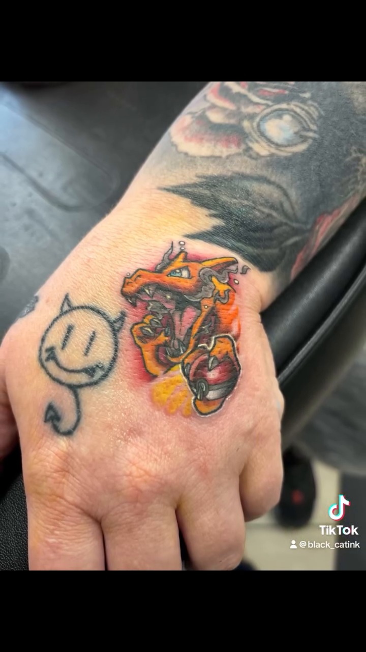 Pokemon character new school tattoo on the hand by Christhian King