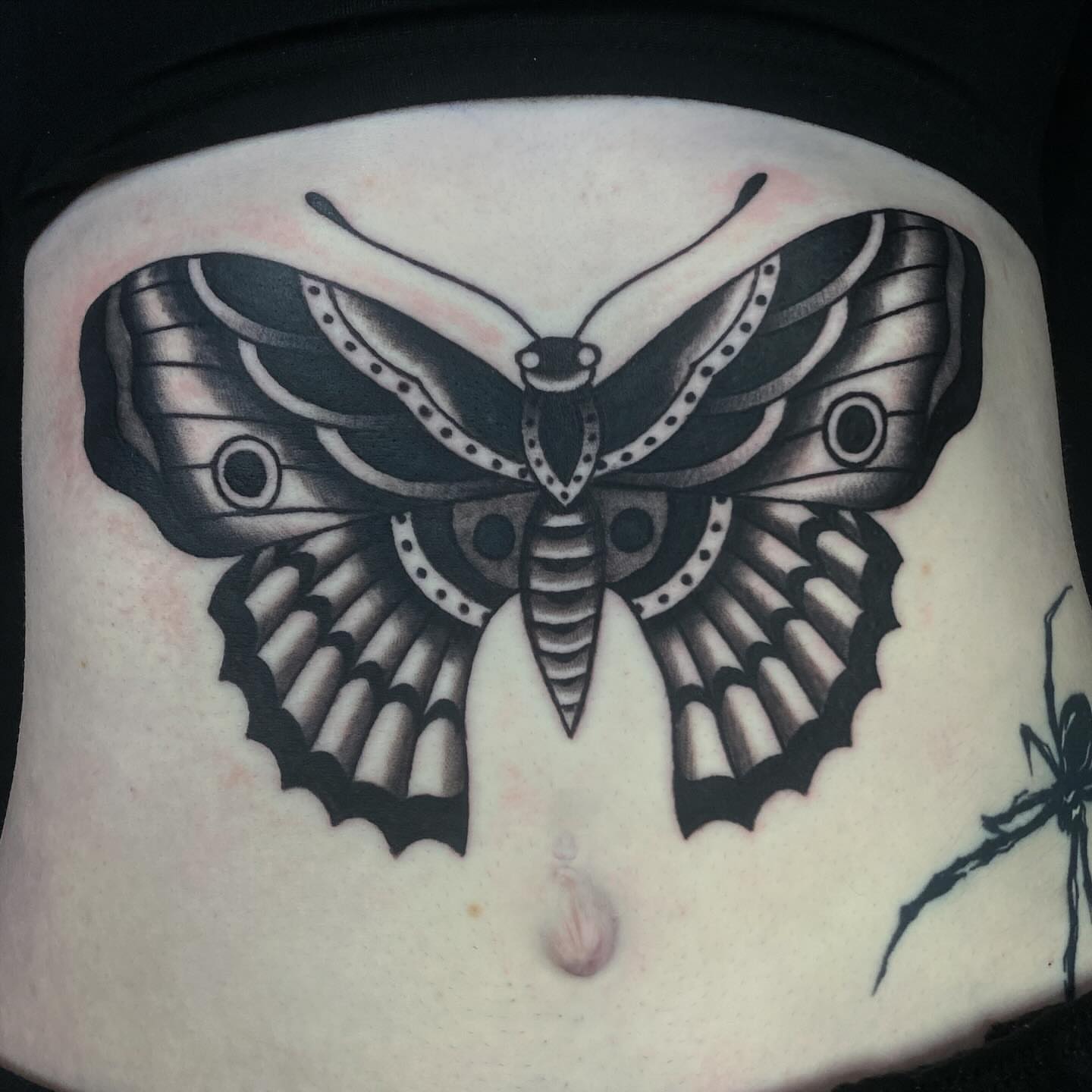 Butterfly black and grey tattoo on the torso by Lindsey Cam Van