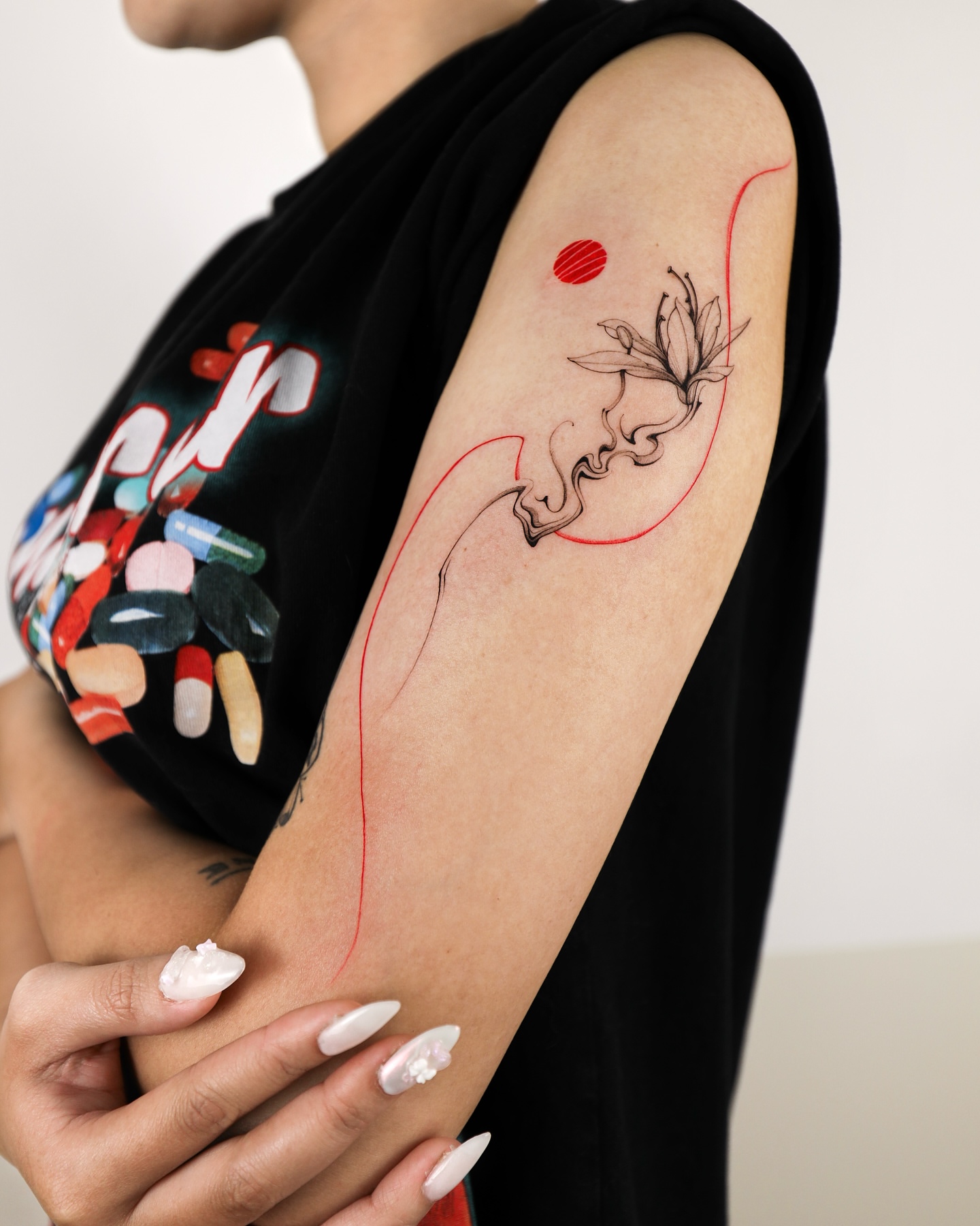Flower and abstract line fine line tattoo on the forearm by ๐๐๐ฆ ๐๐ ๐ฎ๐ฒ๐๐ง