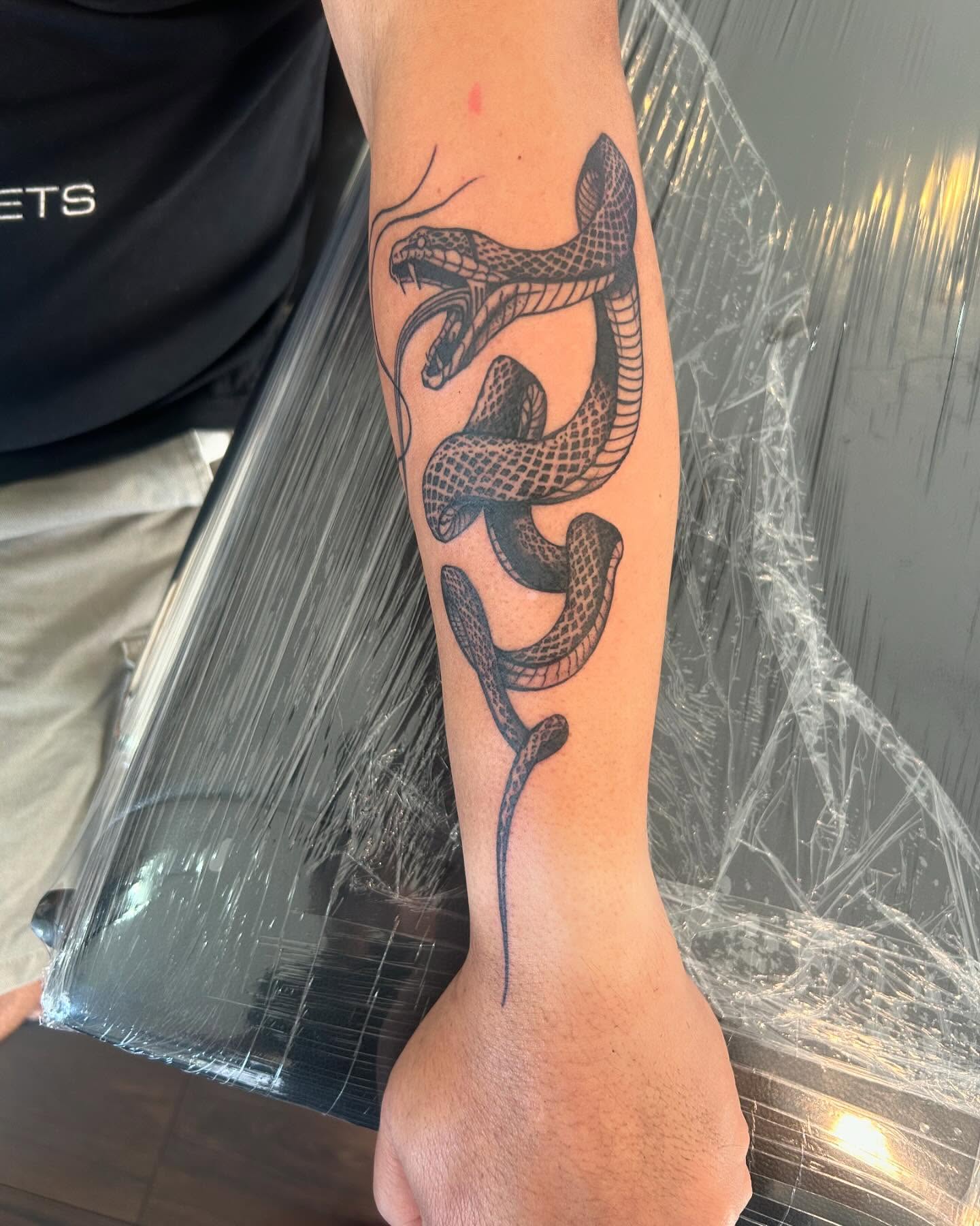 Snake black and grey tattoo on the forearm by ɢɢ sᴛʏʟᴇs