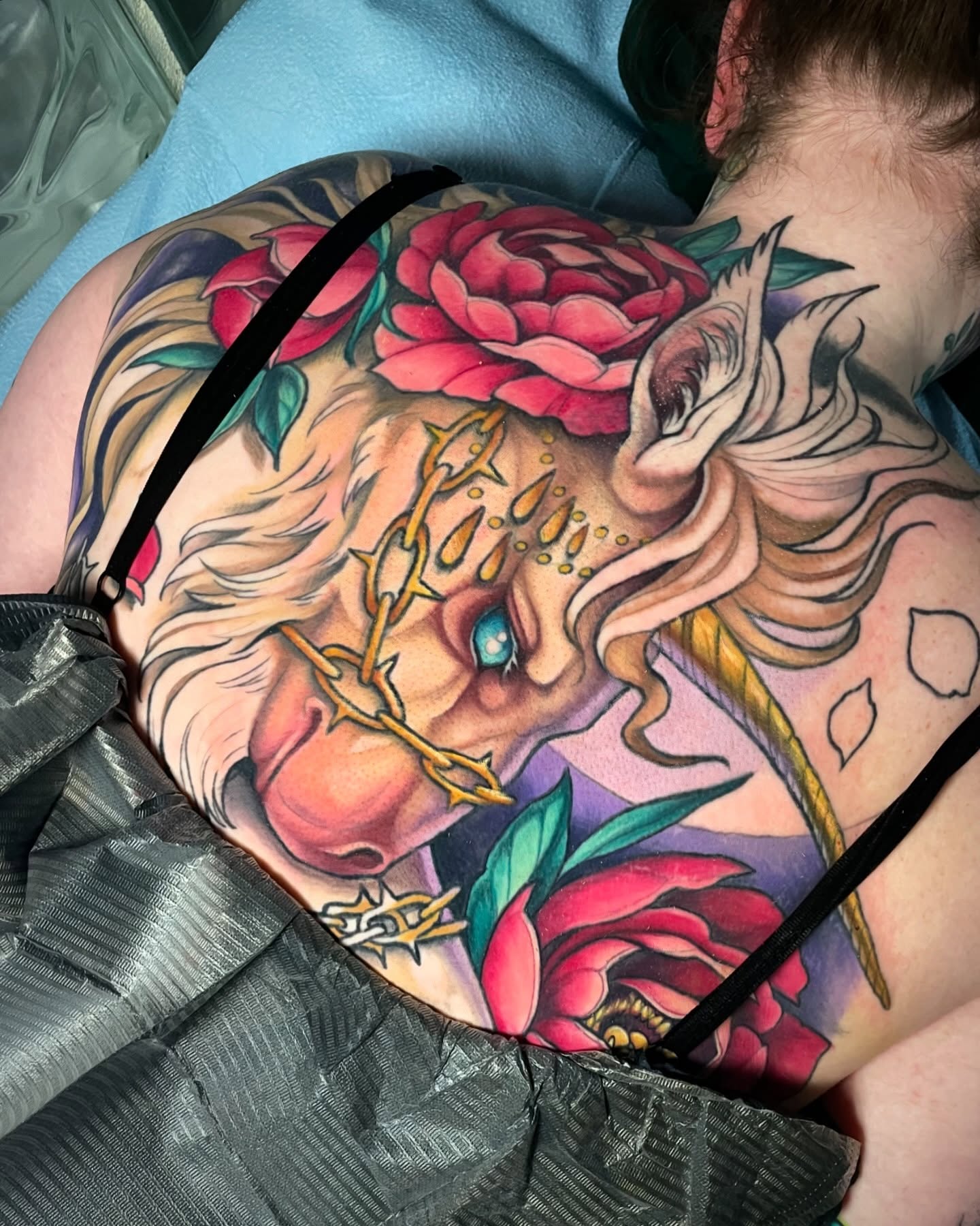 Woman with flowers American traditional tattoo on the back by Leah Marie, Cincinnati