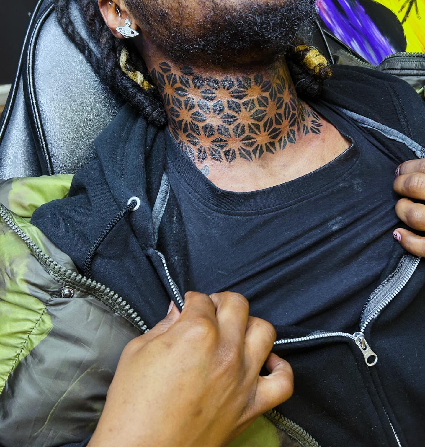 Geometric pattern geometric tattoo on the neck by Rell Washington, Marlow Heights, Maryland
