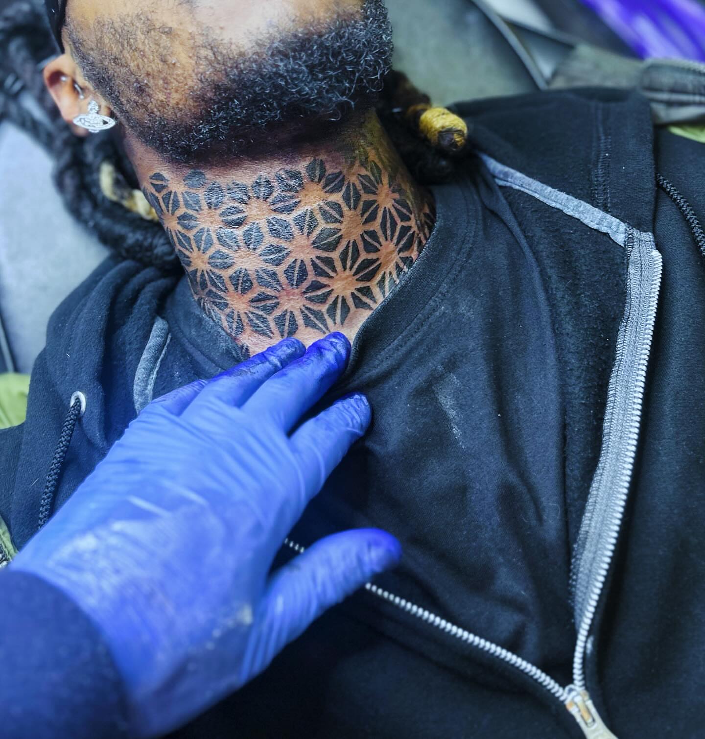 Geometric pattern geometric tattoo on the neck by Rell Washington, Marlow Heights, Maryland