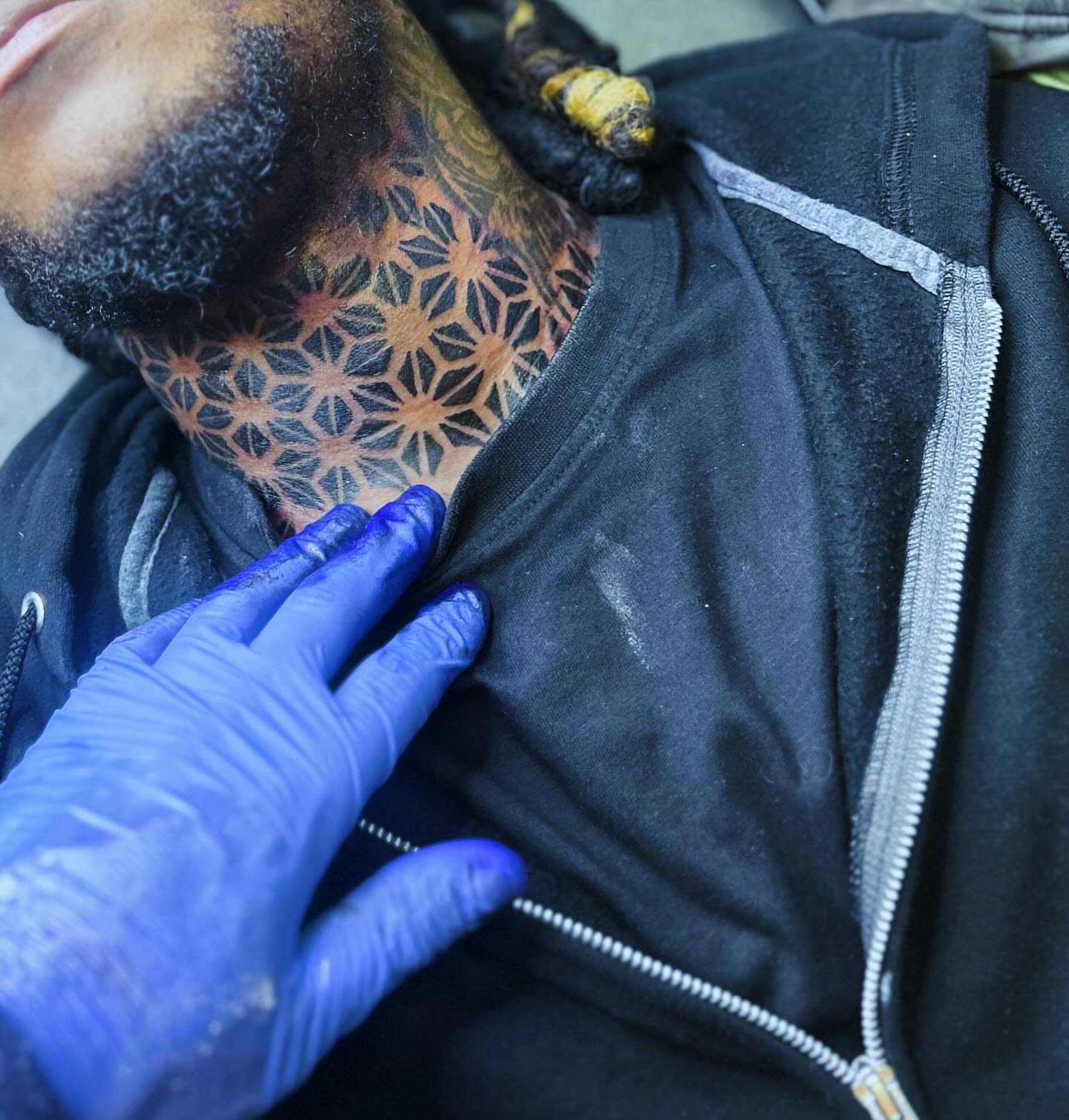 Geometric pattern geometric tattoo on the neck by Rell Washington, Marlow Heights, Maryland