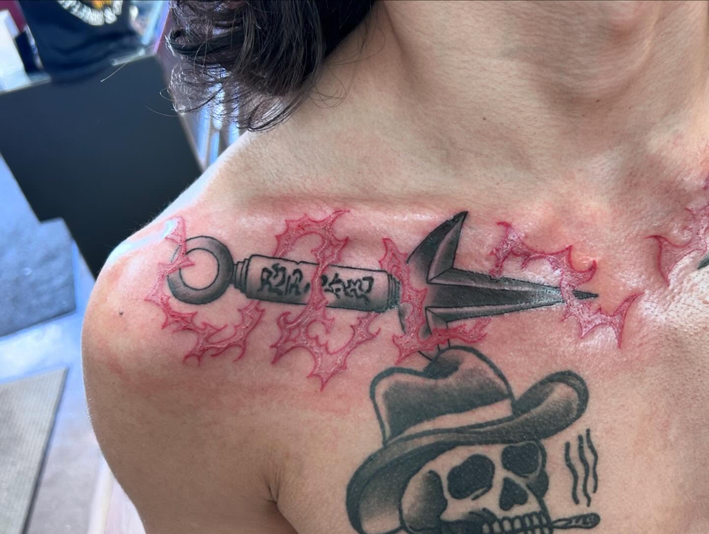 Gun and skull black and grey tattoo on the chest by Ricardo (RJ)