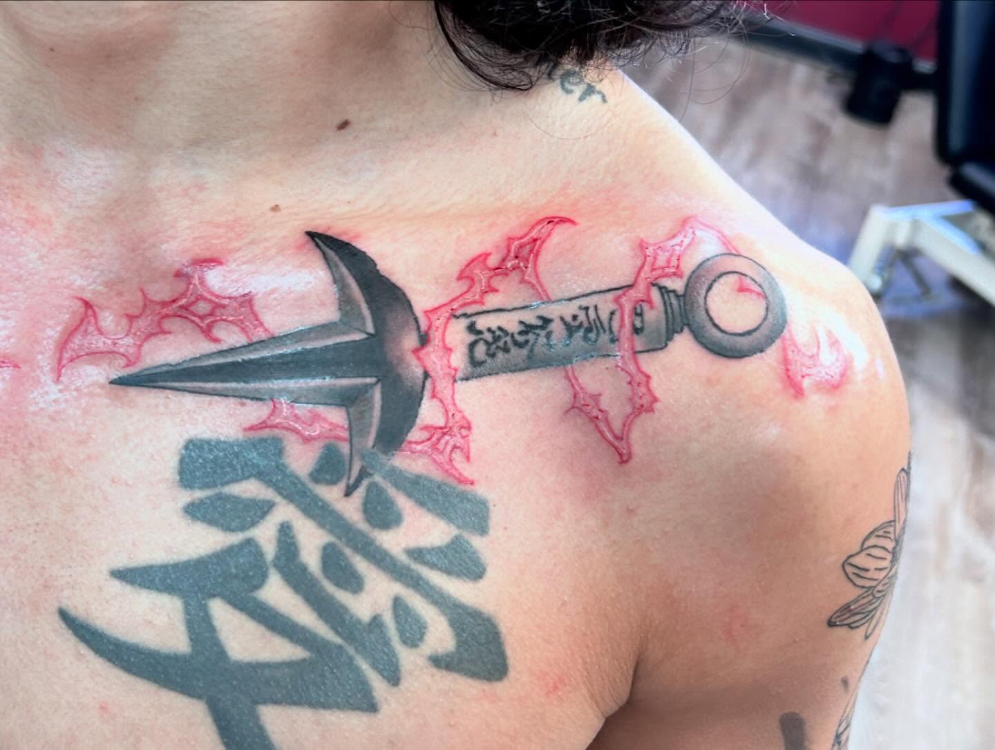 Key and dagger black and grey tattoo on the shoulder by Ricardo (RJ)