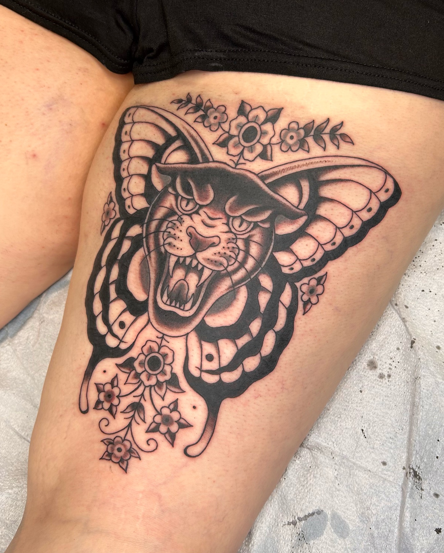 Snake and flowers American traditional tattoo on the thigh by ☻ darby robertson ☻