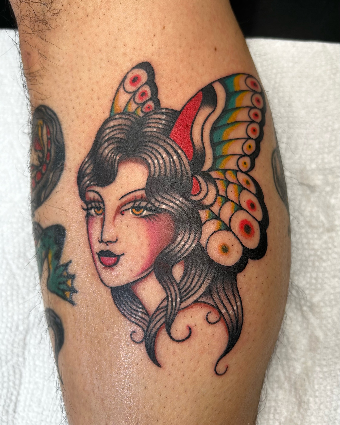 Woman with butterfly wings American traditional tattoo on the thigh by ☻ darby robertson ☻