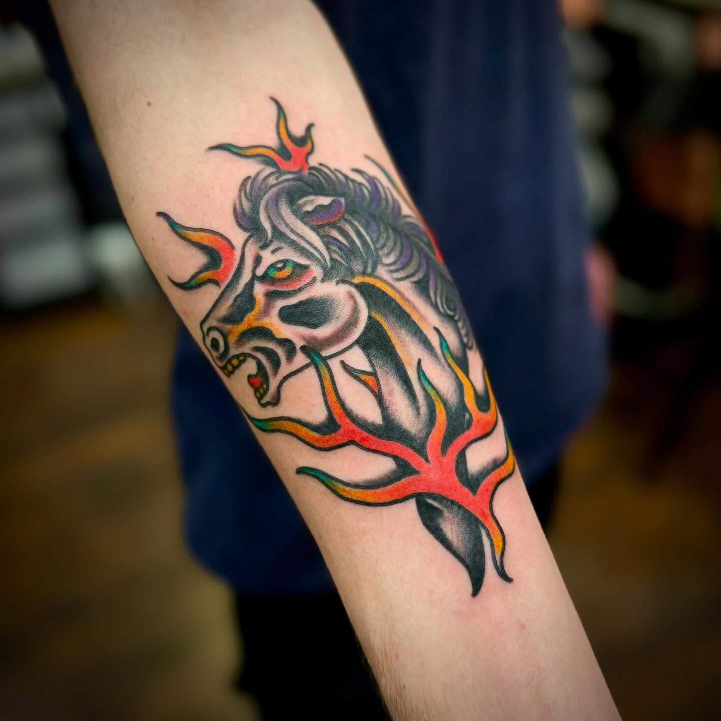 Bull with flames American traditional tattoo on the forearm by Troy Mort, Altoona, Pennsylvania