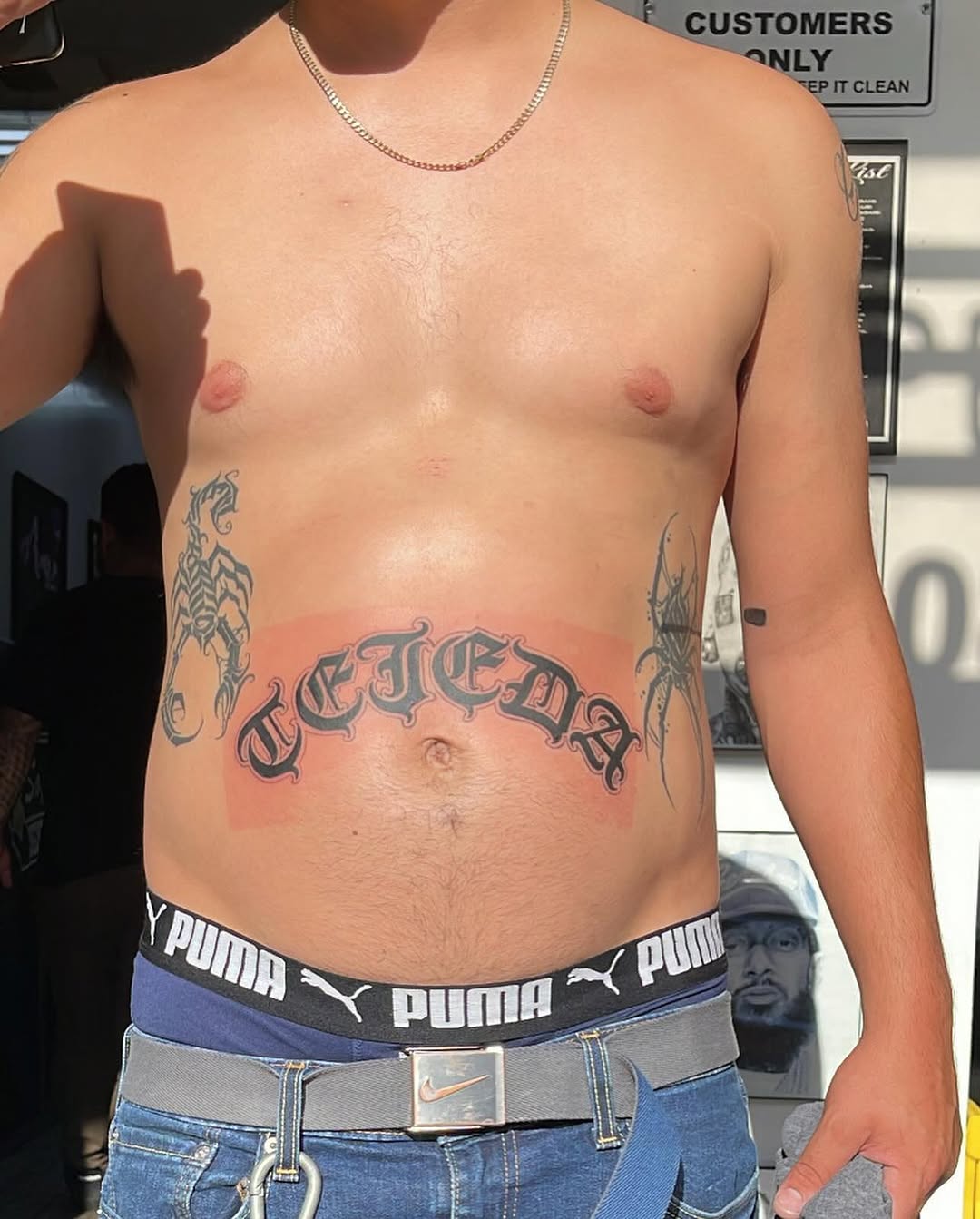 Arch lettering Chicano tattoo on the torso by Renzoe_piercingz