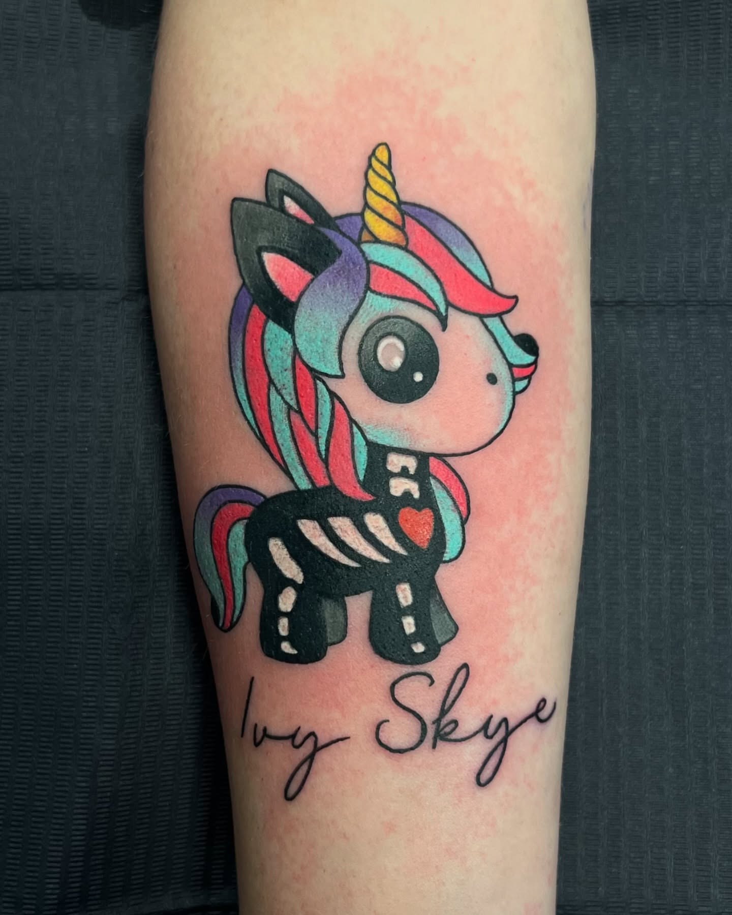 Unicorn new school tattoo on the forearm by Sterling Grice