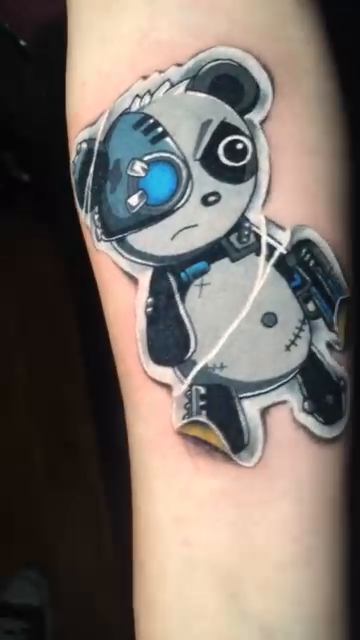 Robot panda tattoo on the forearm by Joshua Shawn