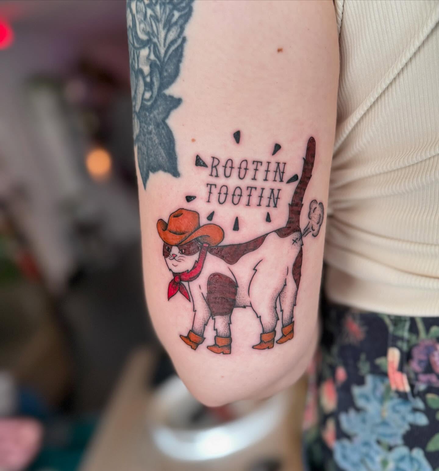 Cat cowboy American traditional tattoo on the forearm by Felicity