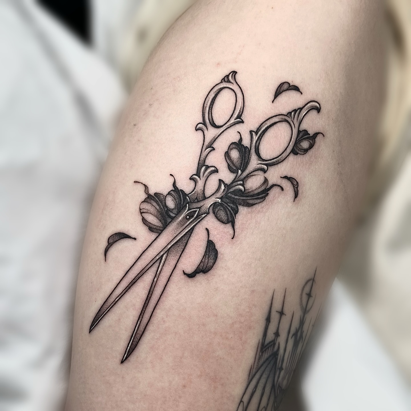 Scissors and floral ornamental tattoo on the forearm by IVY