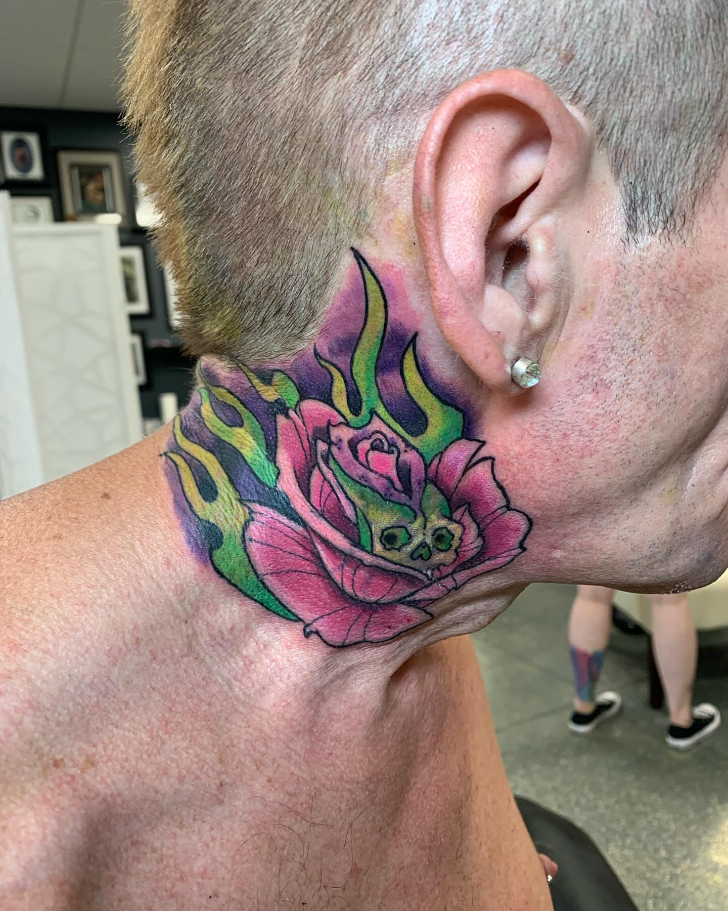 Flaming rose new school tattoo on the neck by @colorrobbie