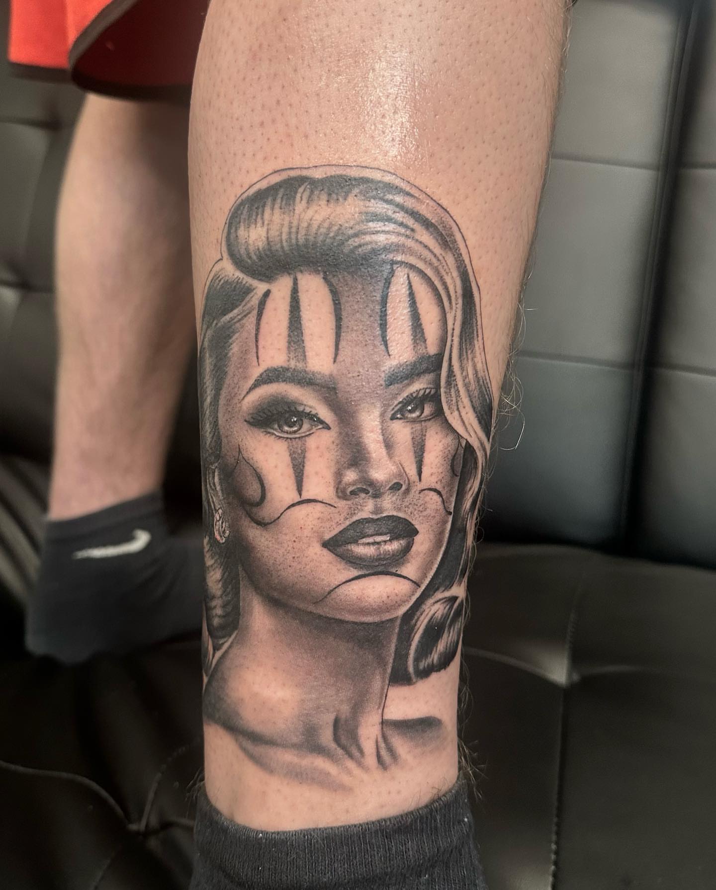 Woman with dramatic makeup realism tattoo on the forearm by Hugo Ruiz-Esparza