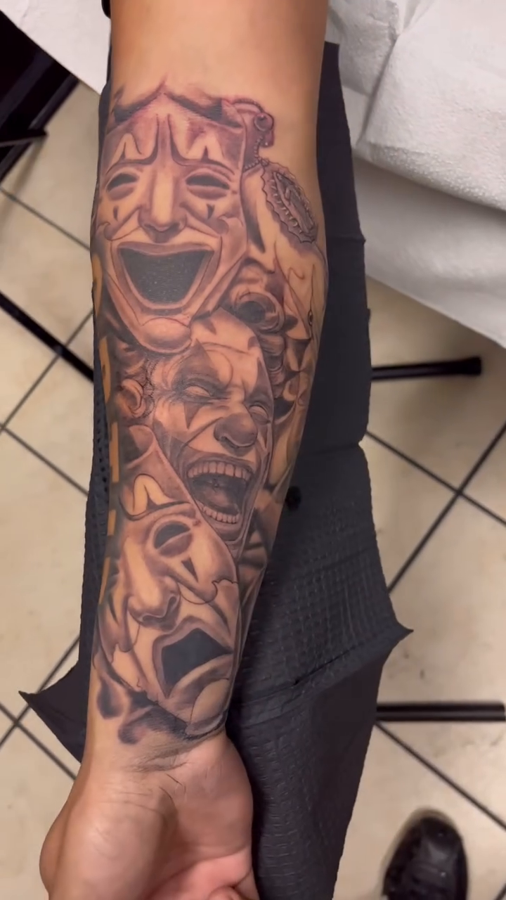 Comedy and tragedy masks with lettering Chicano tattoo by Look