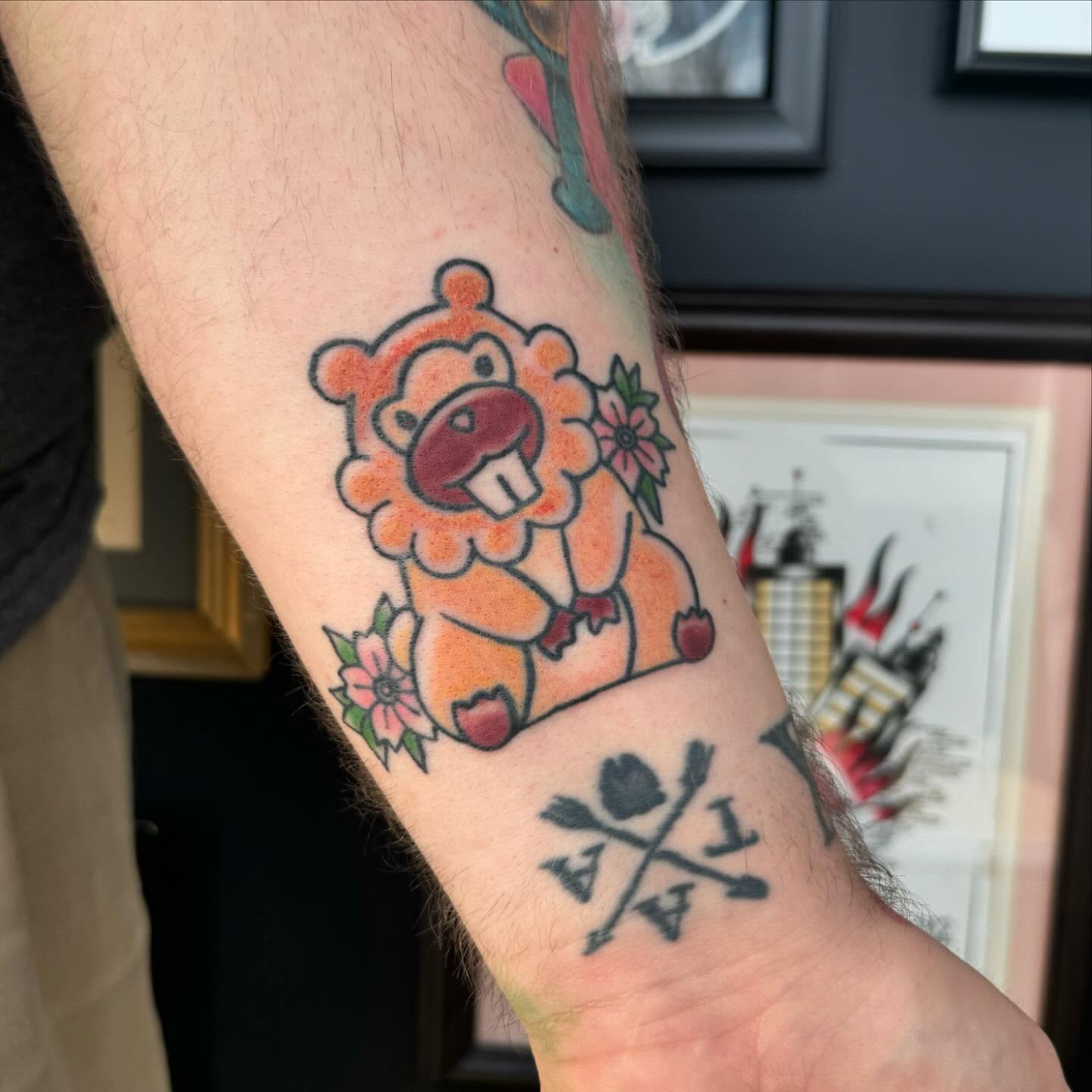 Lion with flowers American traditional tattoo on the forearm by 👾 not ur baby’s ink 👾