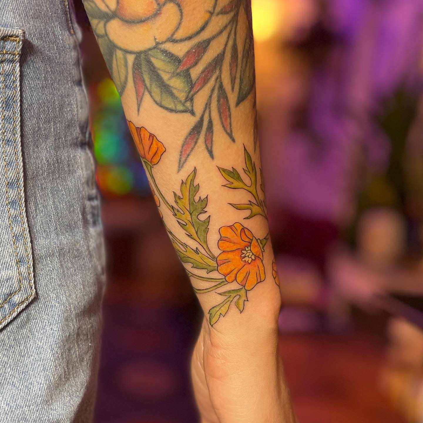 Floral arrangement new school tattoo on the forearm by Reba Slate