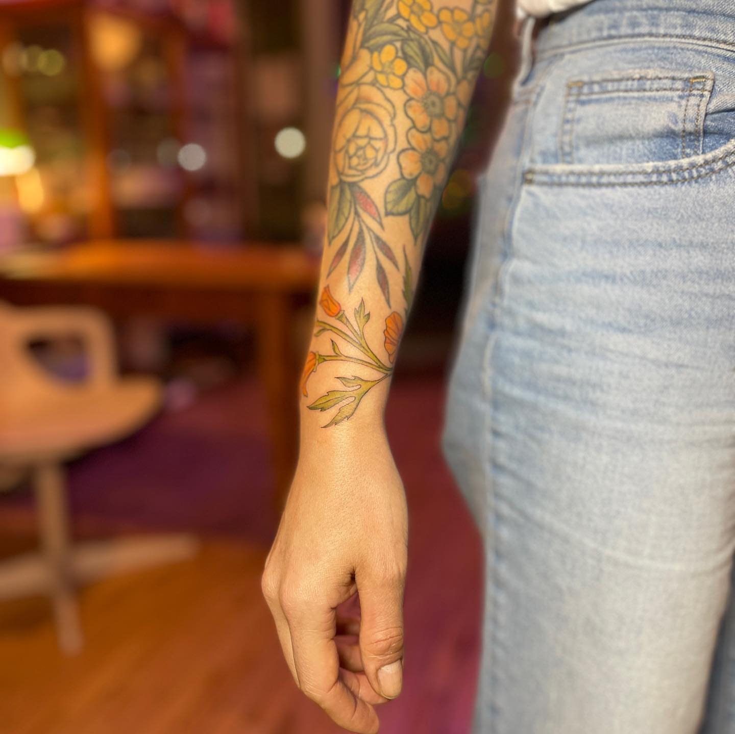 Floral design new school tattoo on the forearm by Reba Slate