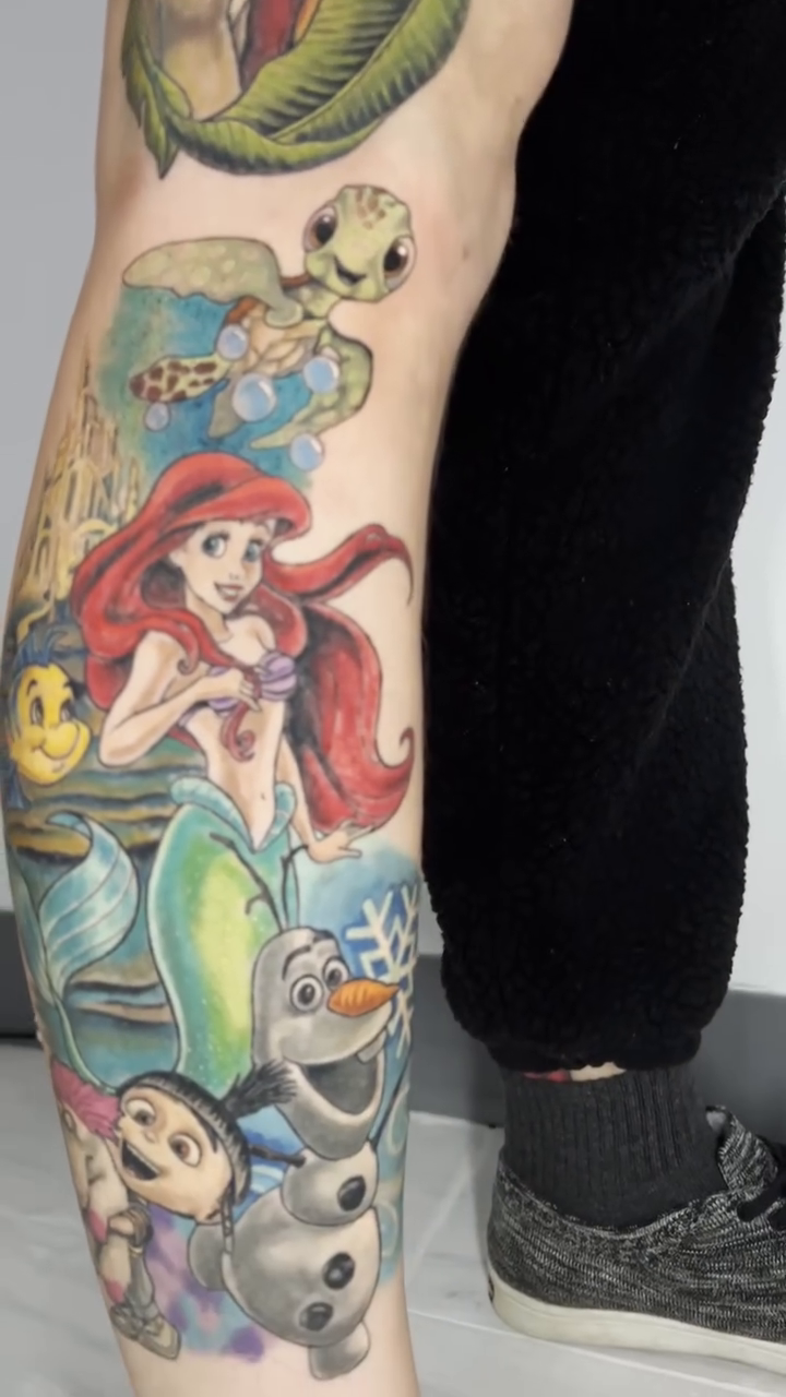 Disney characters leg sleeve new school tattoo on the leg by Justin Rivera