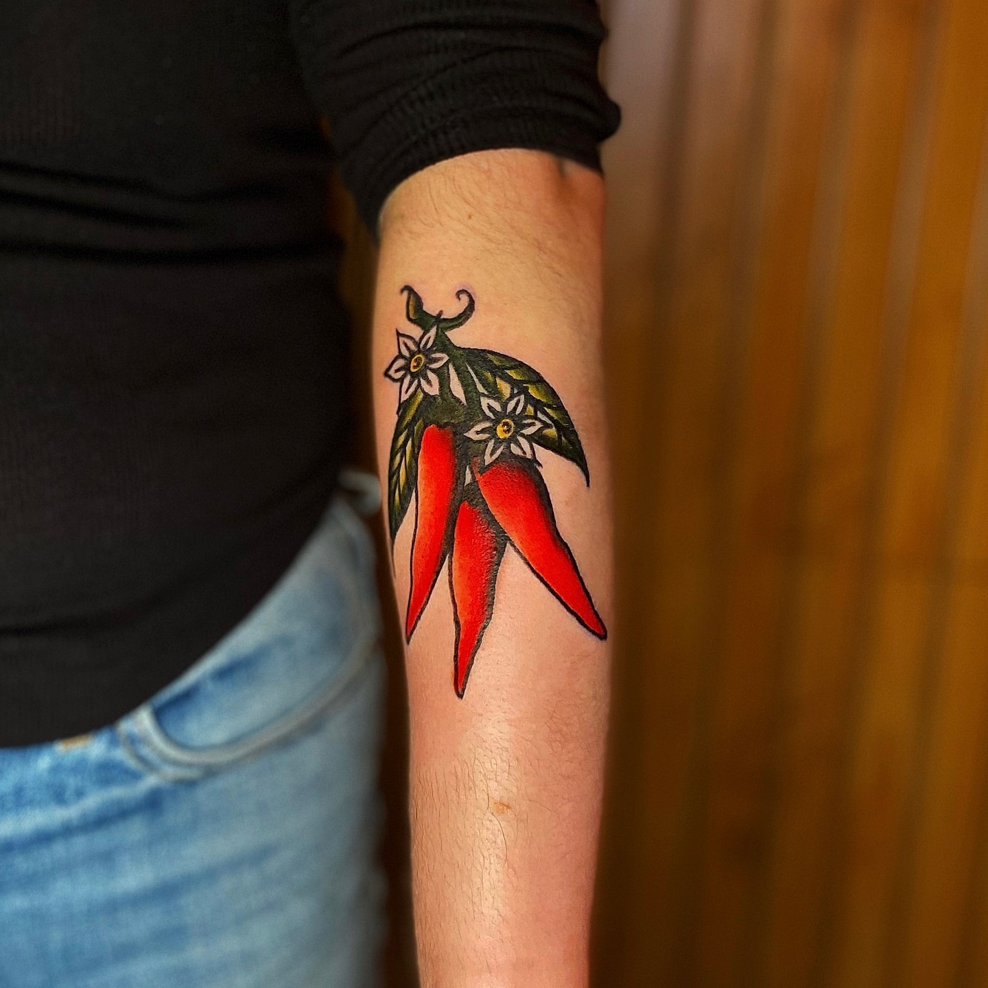 Chili peppers realism tattoo on the forearm by Myka King