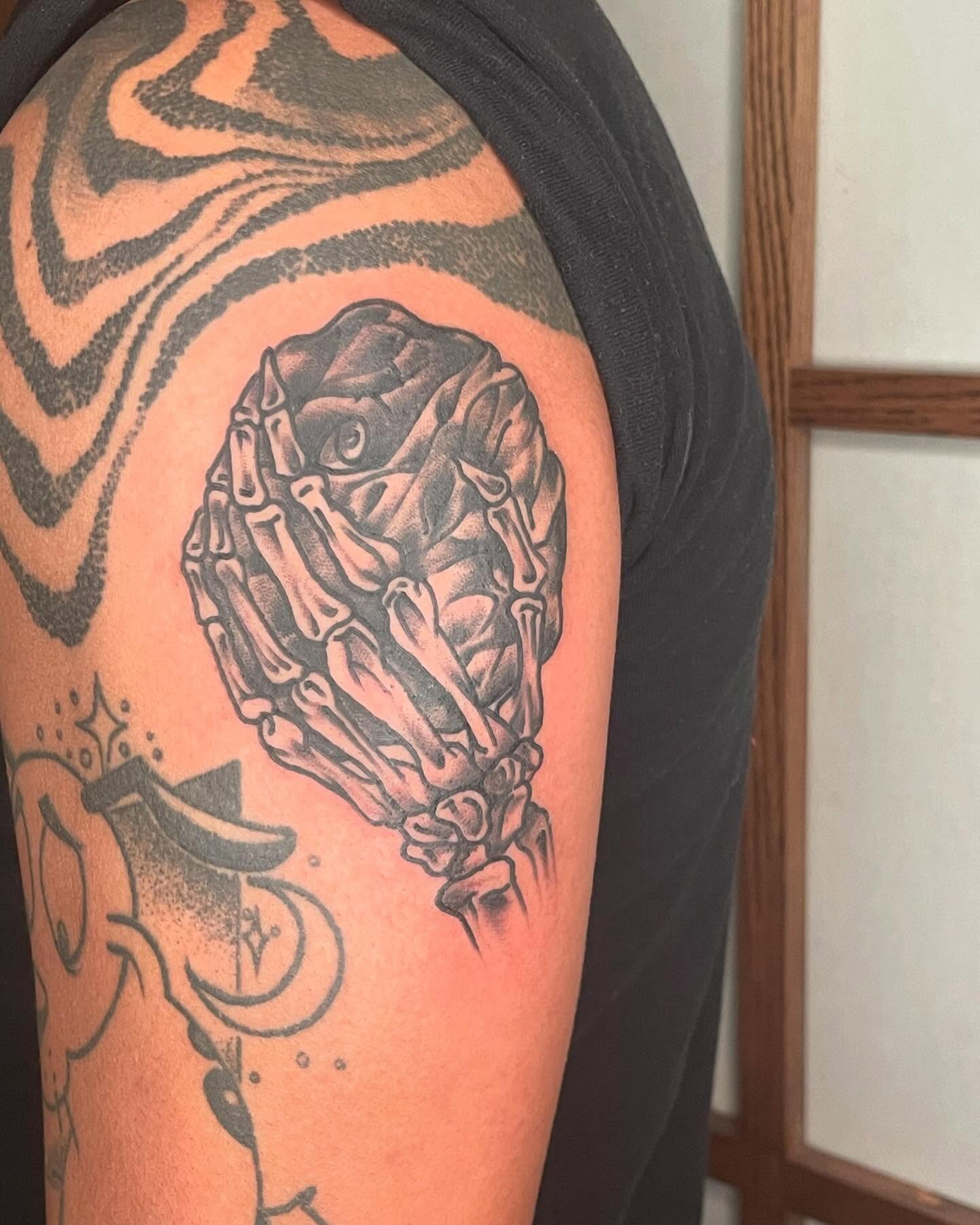 Bone cluster black and grey tattoo on the shoulder by G. Clover ⚧︎, Chicago, Illinois