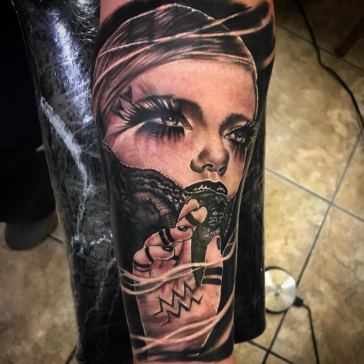Woman with bound hands realism tattoo on the forearm by Tonii Florrez