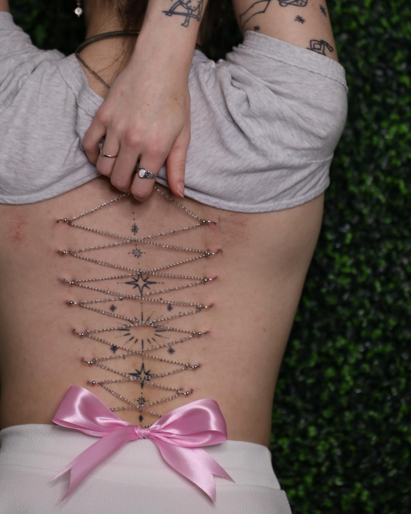 Geometric design geometric tattoo on the torso by Zoie Stiles