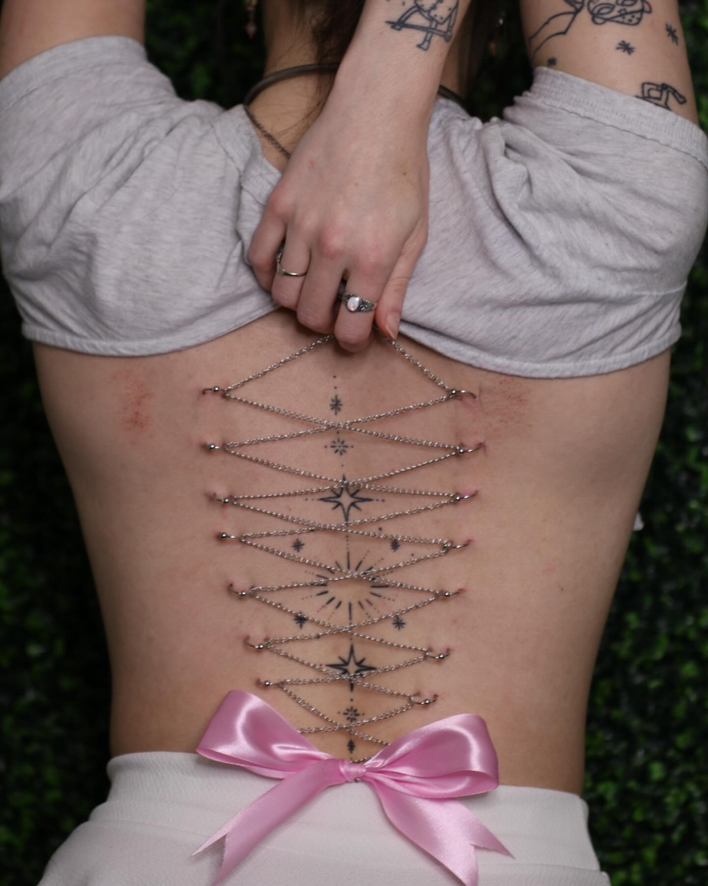 Geometric design geometric tattoo on the torso by Zoie Stiles