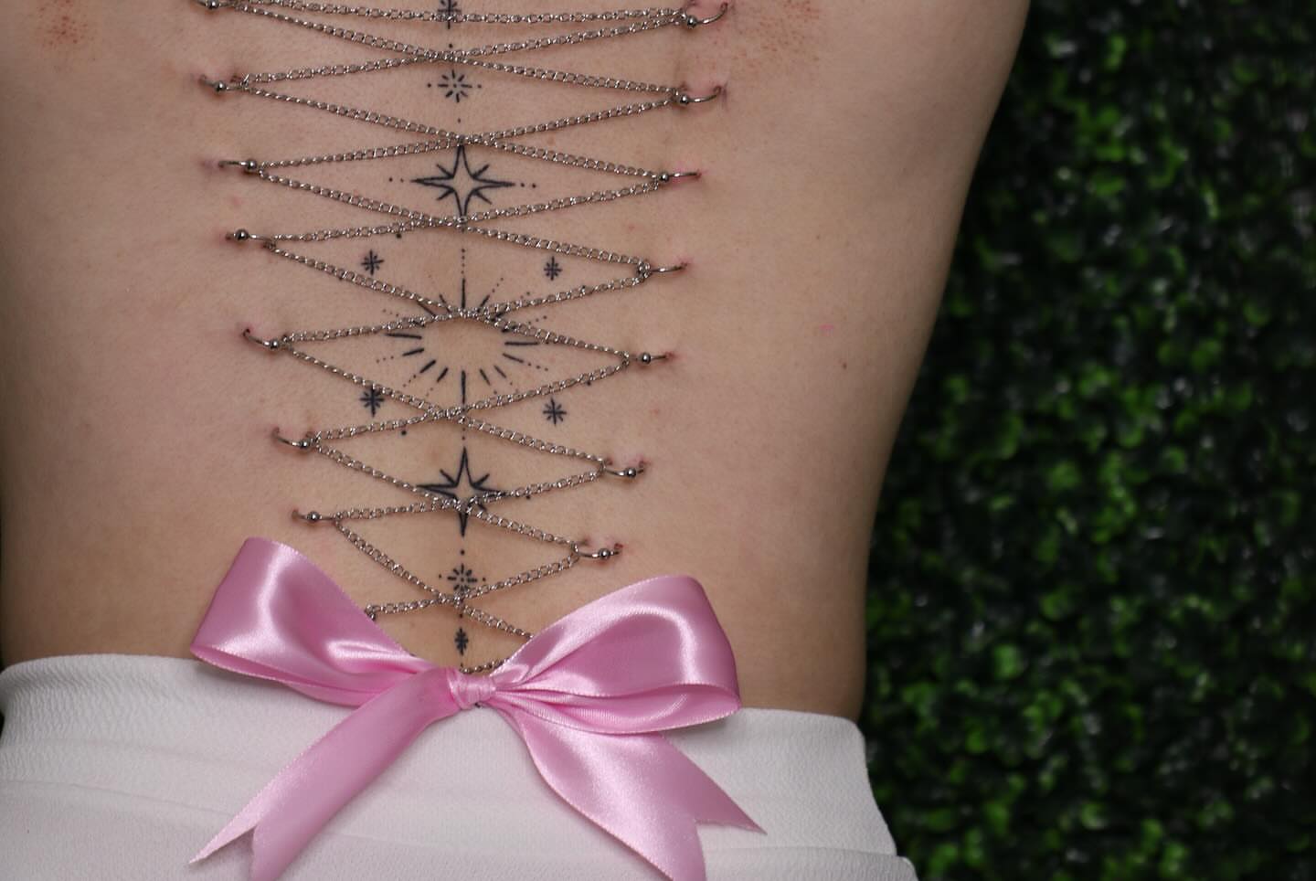 Geometric design geometric tattoo on the torso by Zoie Stiles