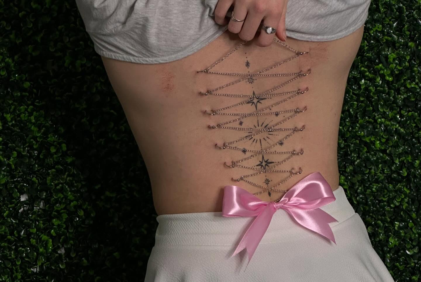 Geometric design geometric tattoo on the torso by Zoie Stiles