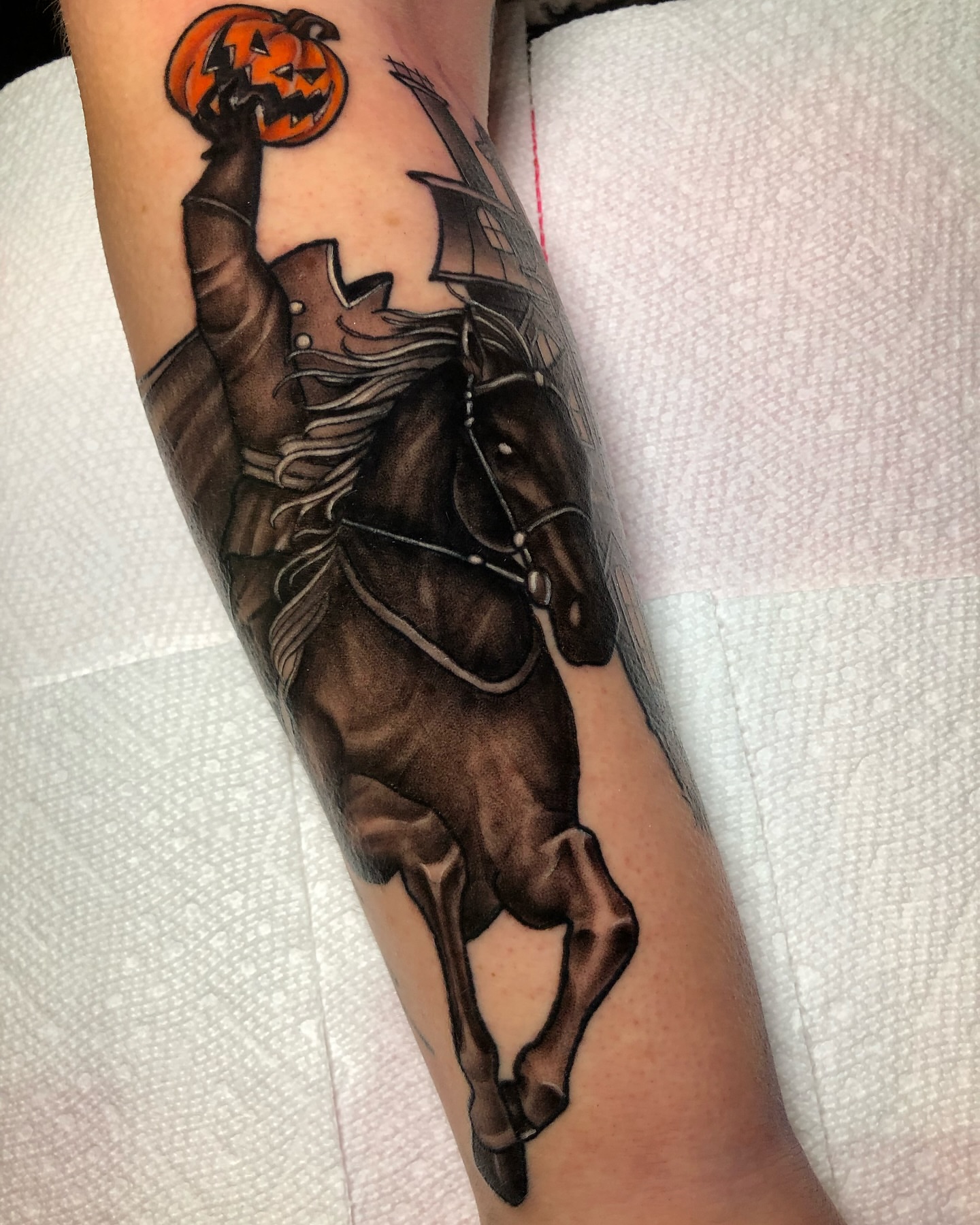 Halloween horseman dark realism tattoo on the forearm by Melissa Brown