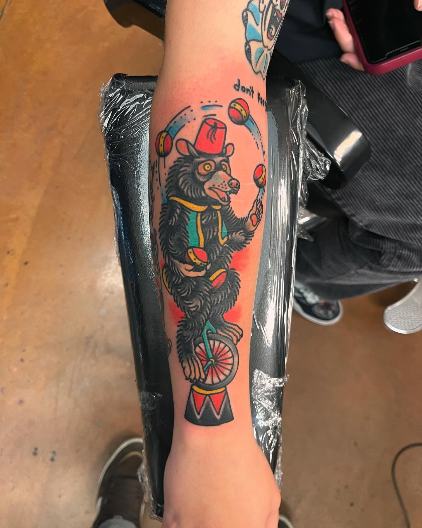 Circus bear juggling American traditional tattoo on the forearm by 💀good To the Grave💀