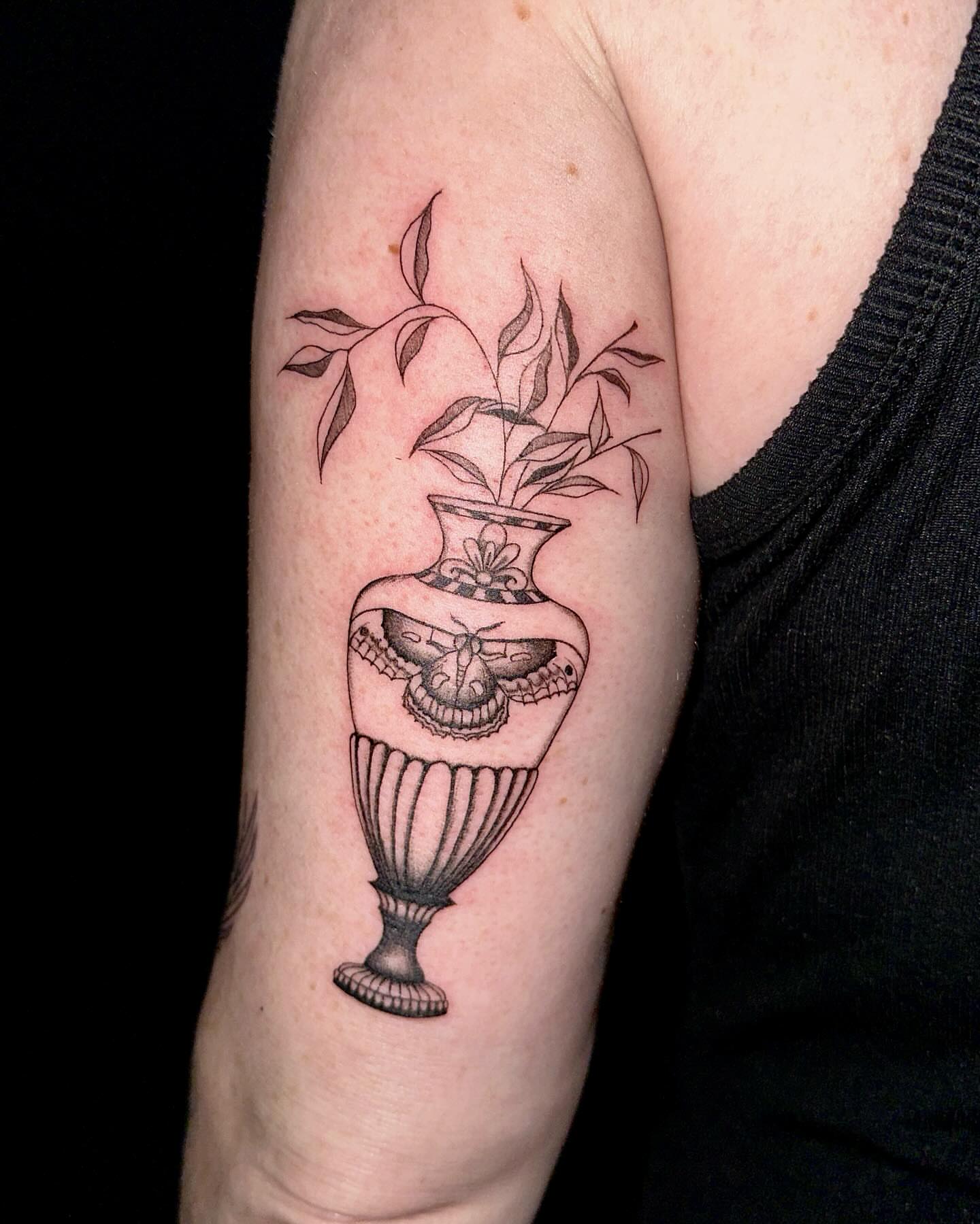 Vase with butterfly and plant realism tattoo on the forearm by Marie Novotny, Lakewood, Ohio