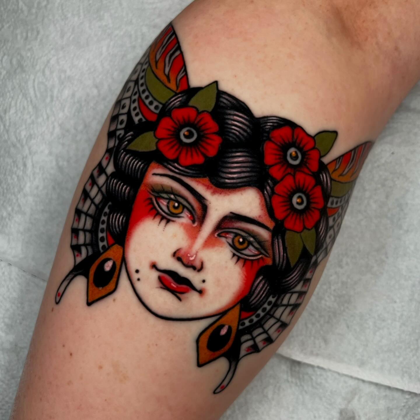 Woman's face American traditional tattoo on the forearm by Hailey Johnson
