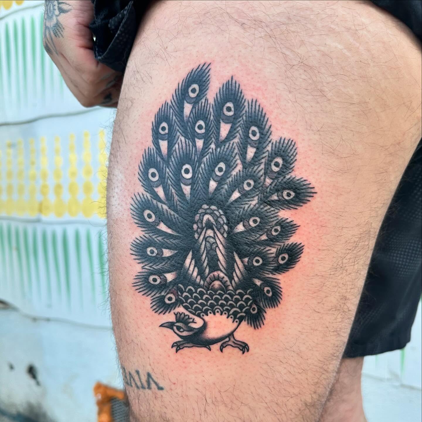 Peacock black and grey tattoo on the thigh by Jess Ritchie, Austin, Texas