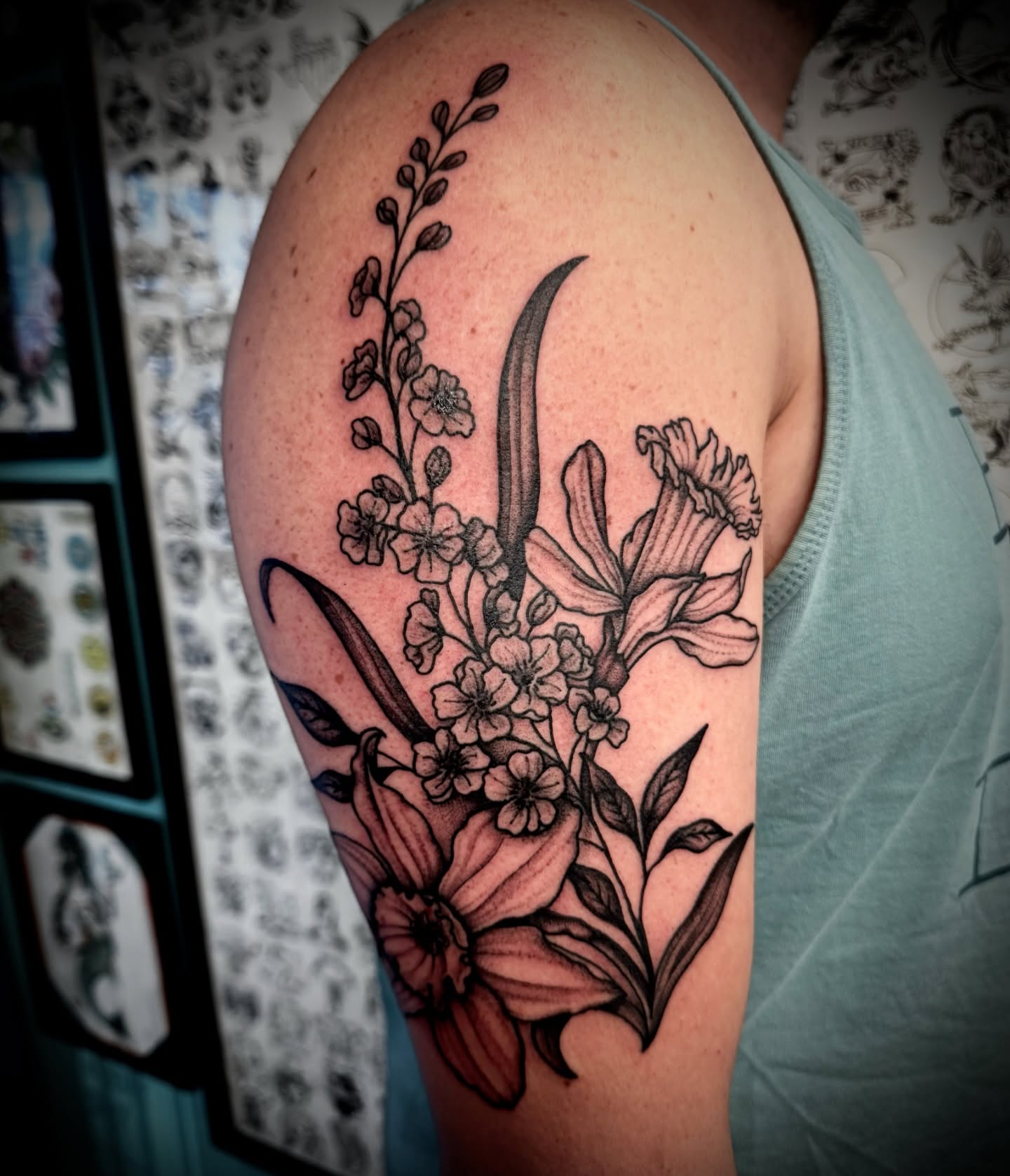 Floral bouquet black and grey tattoo on the shoulder by Kristen