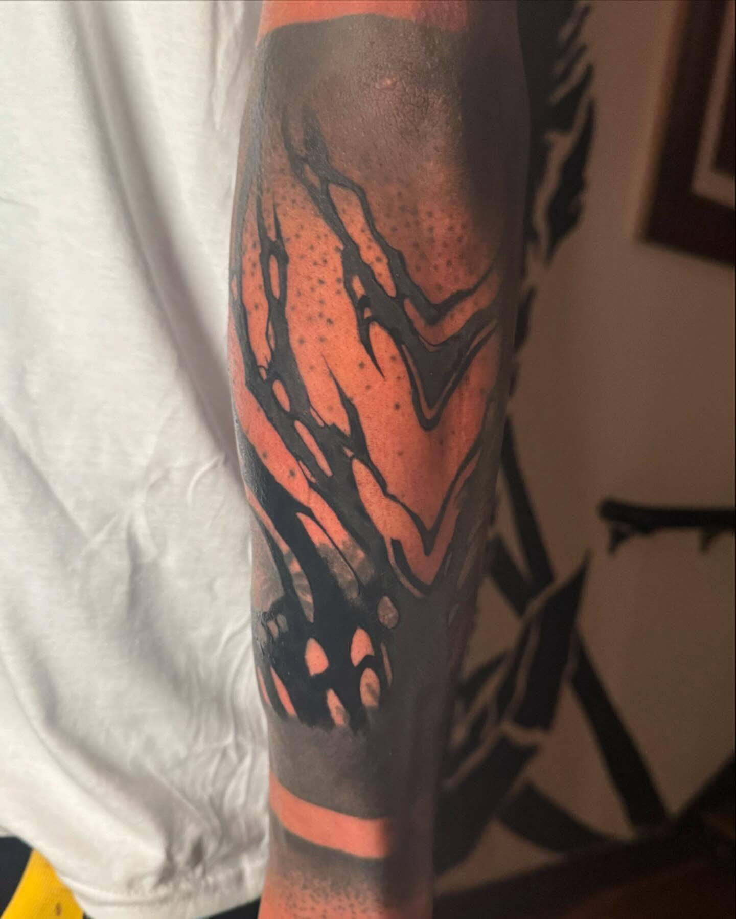 Abstract flame dotwork tattoo on the forearm by Dylan Orbock, Berkeley, California