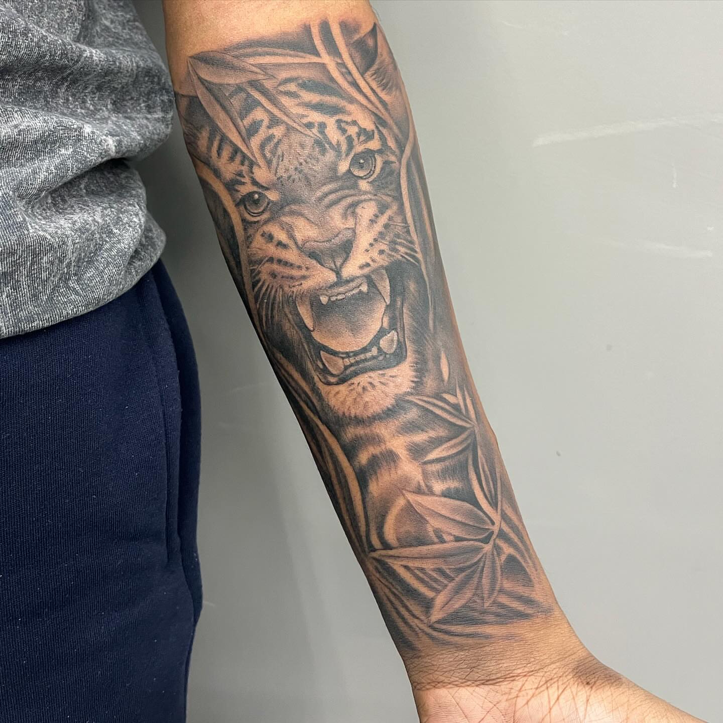 Roaring tiger realism tattoo on the forearm by Detroit Tattoo Artist