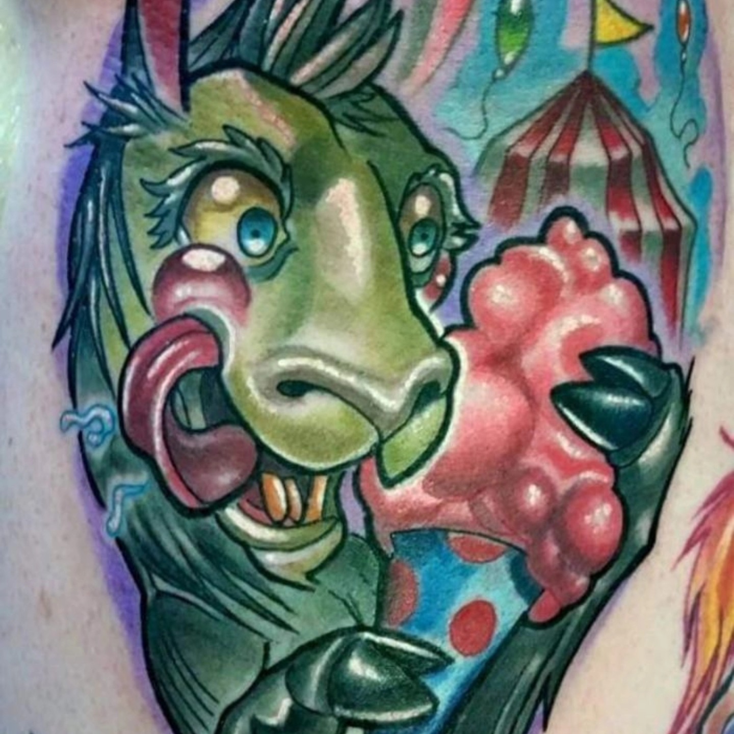 Alien American traditional tattoo on the upper arm by Edward Argibay