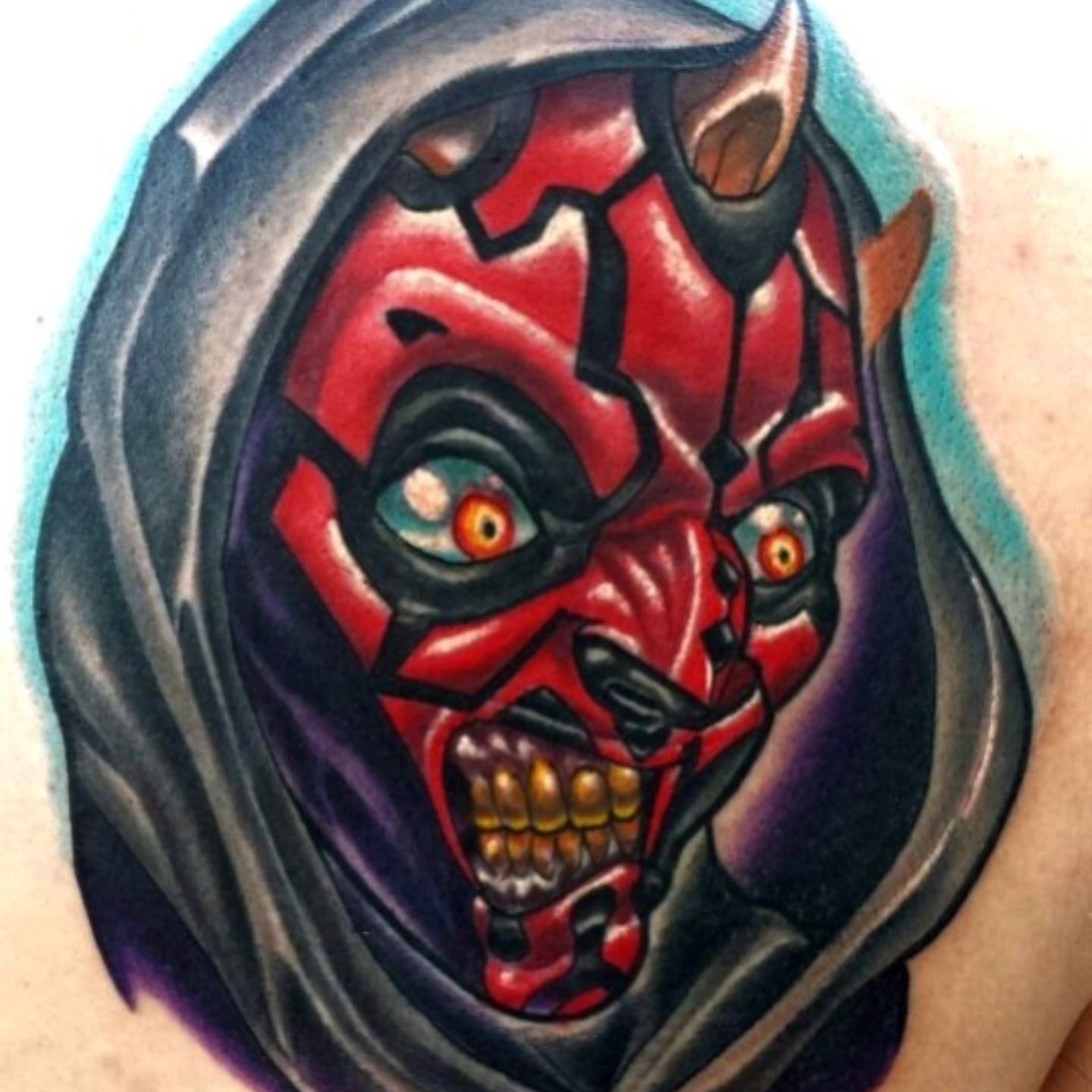 Demon mask dark realism tattoo on the shoulder by Edward Argibay
