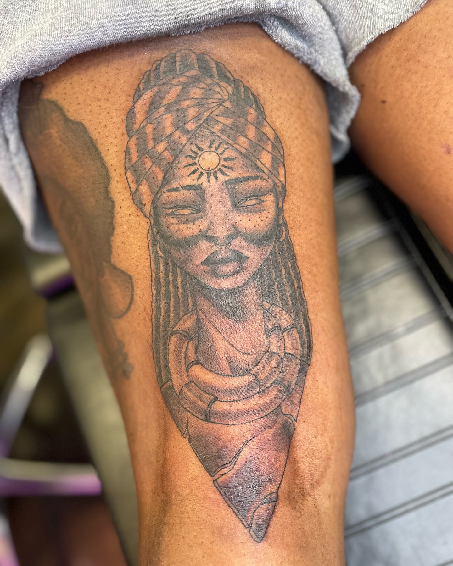 Woman with turban realism tattoo on the thigh by Tattoos By Rico